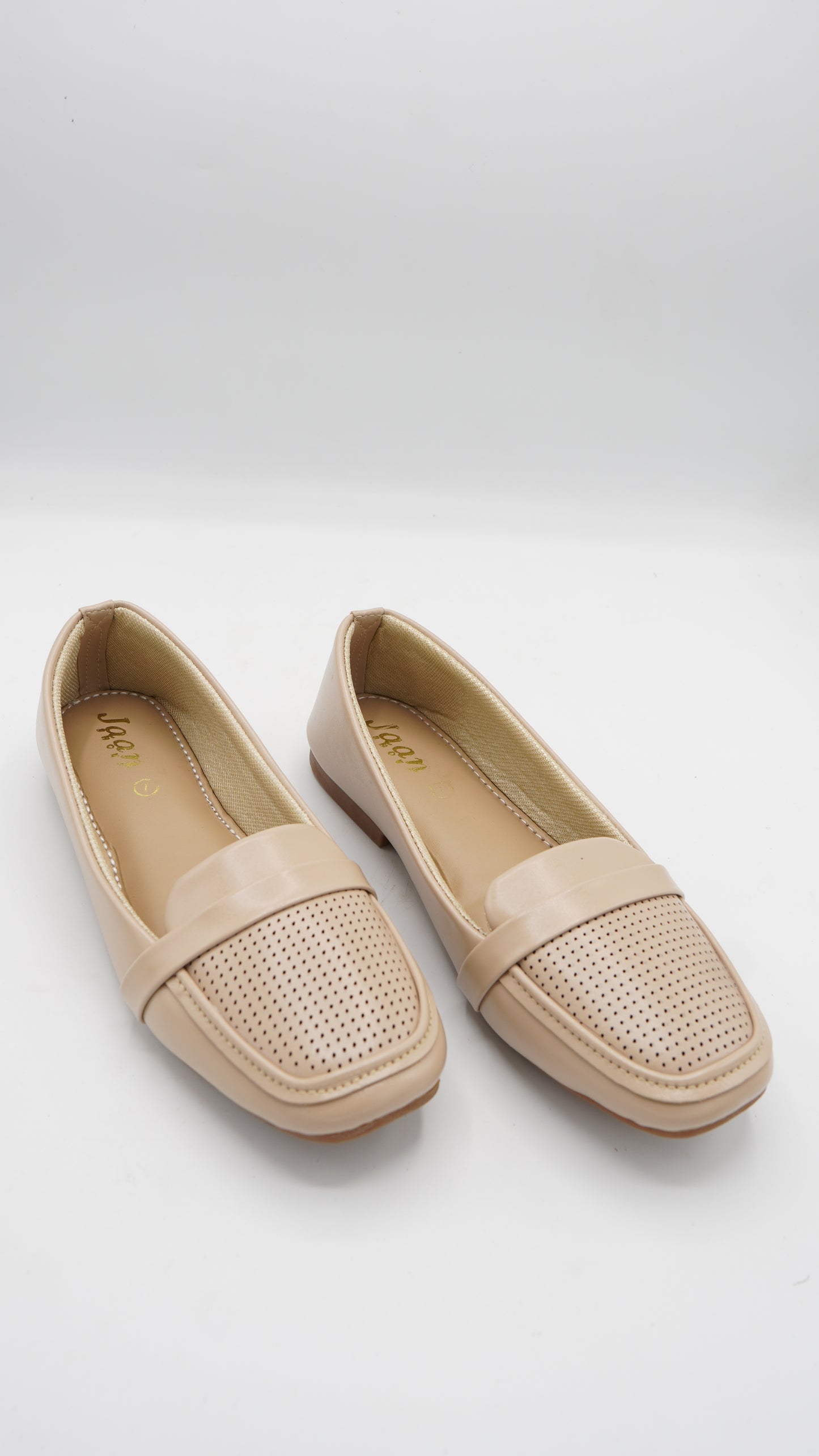 Elegant Laser-Cut Pumps in Nude