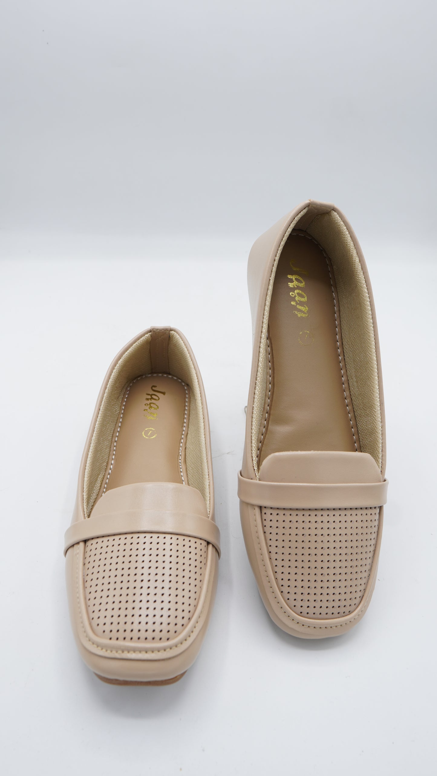 Elegant Laser-Cut Pumps in Nude