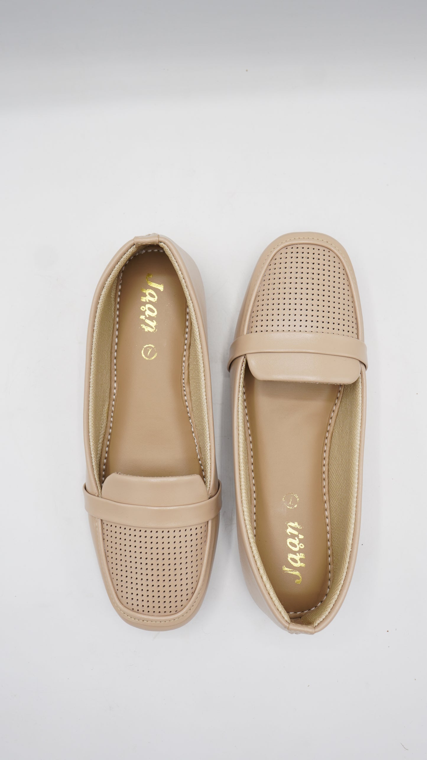 Elegant Laser-Cut Pumps in Nude